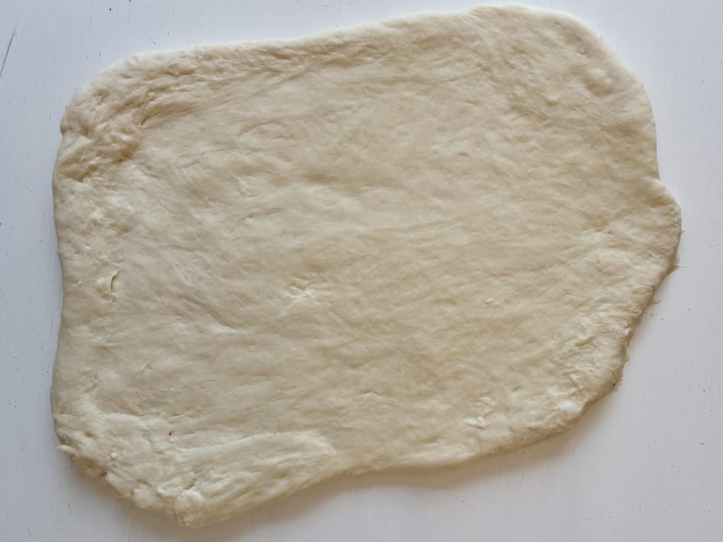 Sauerteig Fladenbrot Teig flach ausgewallt